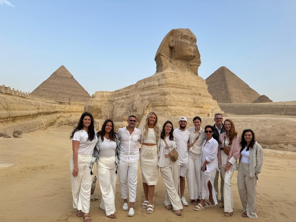 Group of visitors photographed in front of the Great Sphinx of Giza