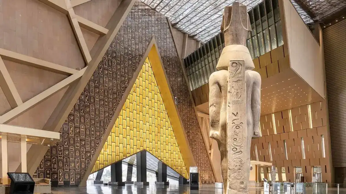Grand Egyptian Museum after-hours tour with visitors exploring ancient Egyptian artifacts