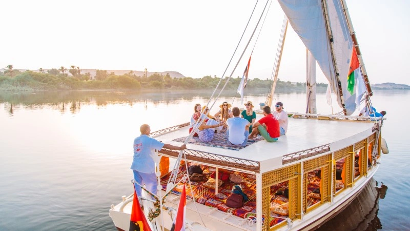 Small wooden felucca sailing on the Nile in Cairo