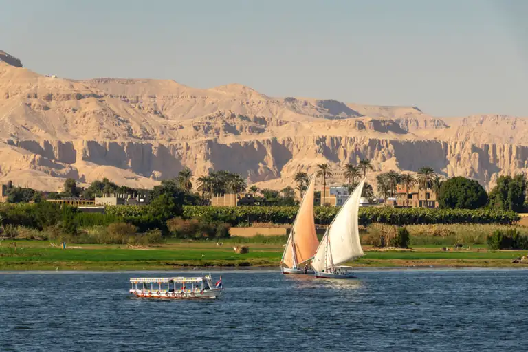 Different types of boats sailing on the Nile in Cairo